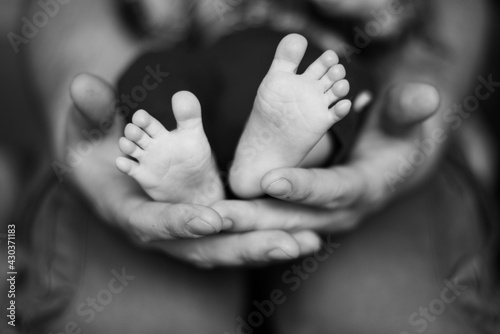 baby feet on black