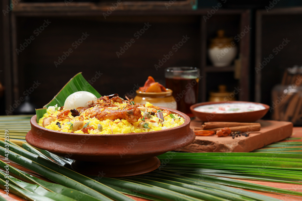 Chicken dum Biryani_Indian Biriyani_wooden background Chicken dum Biryani_Indian Biriyani_wooden background