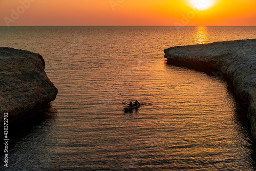 Kayaking under sunset lights in S'Archittu photo
