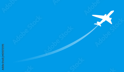 Airplane flight in a blue sky. Rising aircraft silhouette.