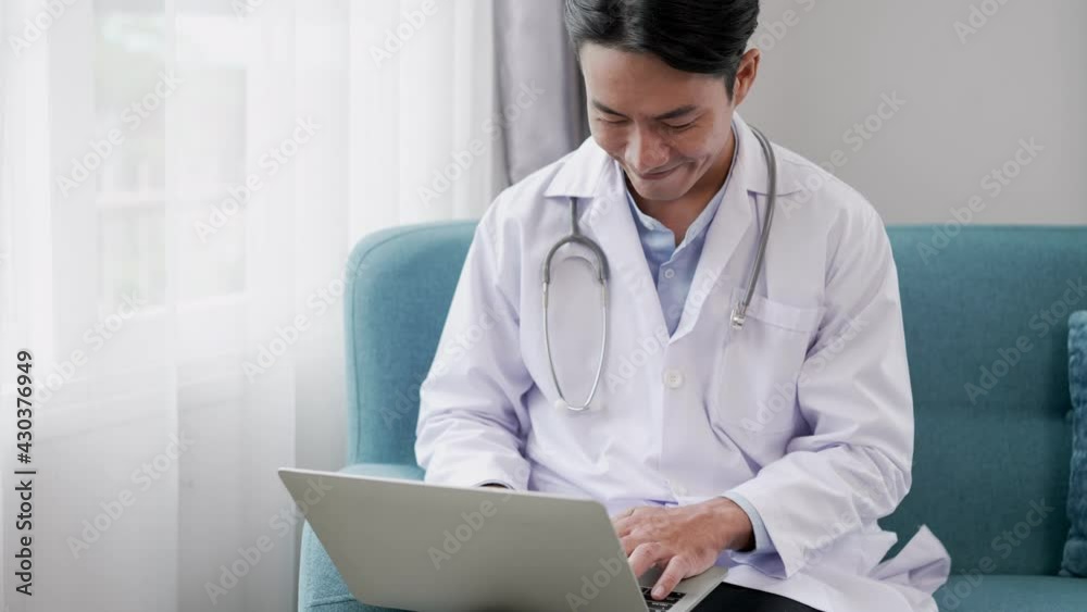 Young doctor giving counseling to patients on Internet laptop Young doctor giving counseling to patients on Internet laptop