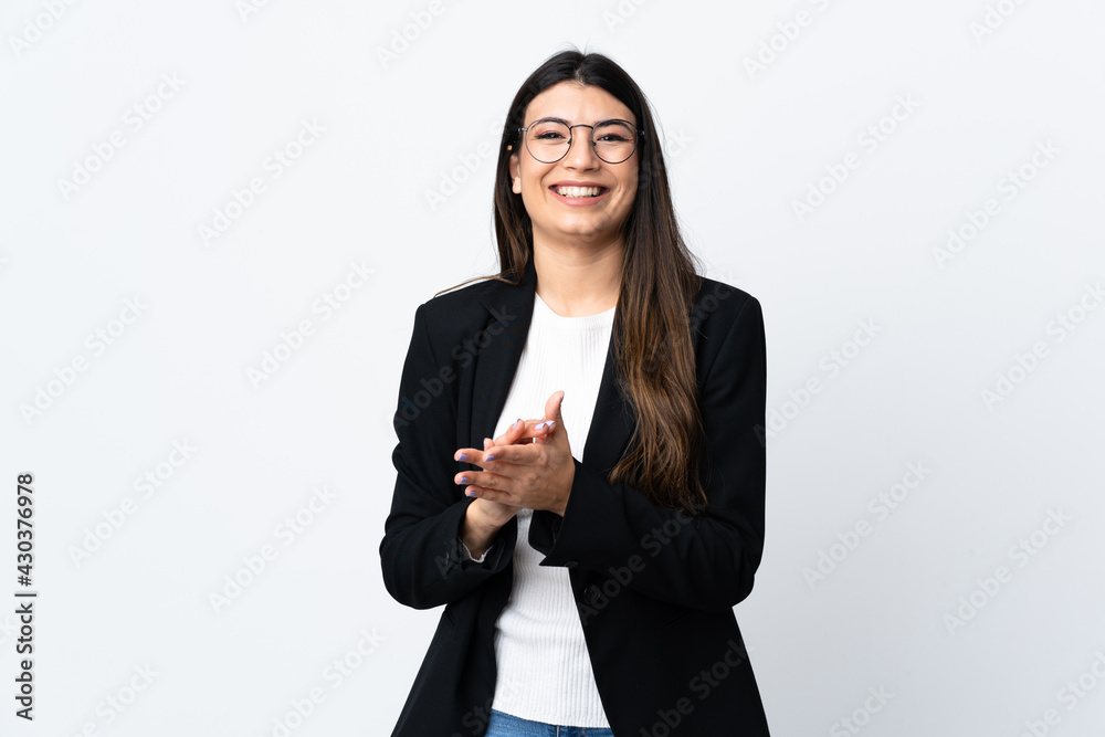 Business woman over isolated white background applauding Business woman over isolated white background applauding