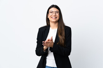 Business woman over isolated white background applauding