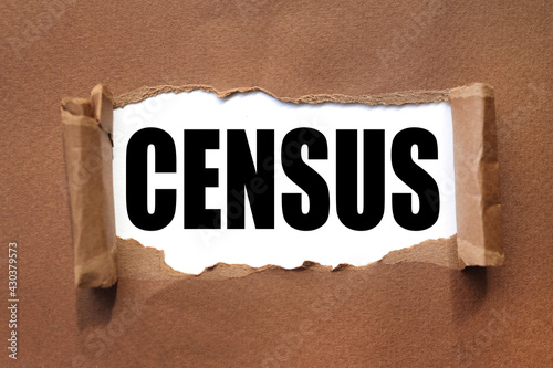 CENSUS. text inside torn brown paper. white sheet with black font.