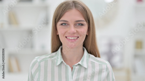 Portrait of Smiling Young Woman Looking at Camera 