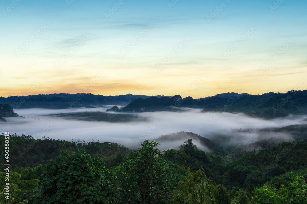 Beautiful views of mountains in the mist at sunrise time, Ranong