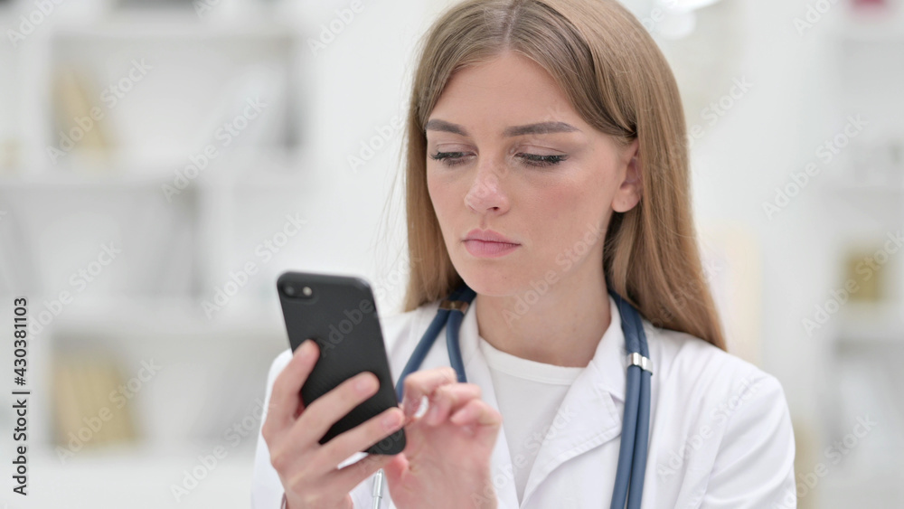 Portrait of Focused Young Doctor using Smartphone Portrait of Focused Young Doctor using Smartphone