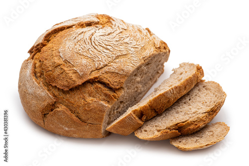 Fotografia, Obraz Round peasant bread with cut pieces. Isolate on white background