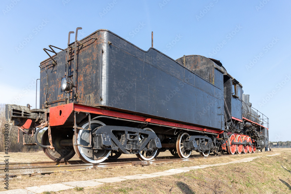 Naklejka premium old steam locomotive on rails