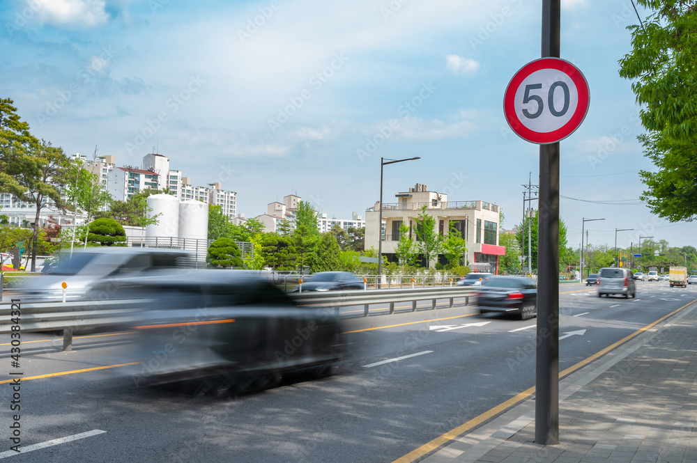 Traffic signs speed limit on the road - obrazy, fototapety, plakaty 