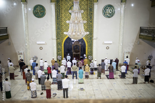 Situbondo, Indonesia - 26 April 2021 : indonesian muslim people (taraweeh) tarawih pray at Al Abror Mosque with social distancing