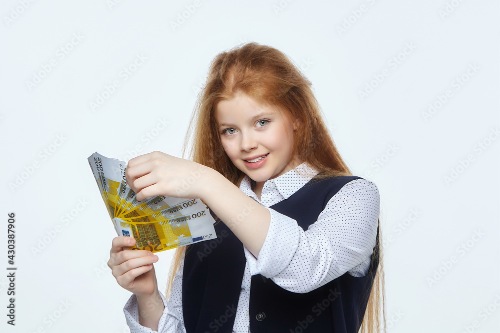 attractive red-haired girl holds 200 euro banknotes in her hands attractive red-haired girl holds 200 euro banknotes in her hands
