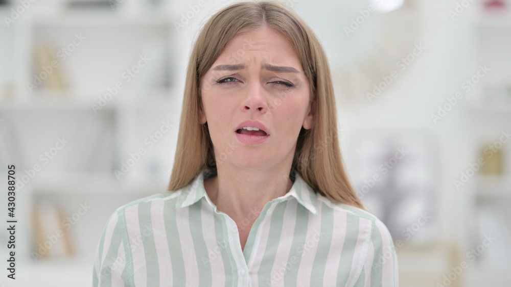 Portrait of Sick Young Woman Sneezing 