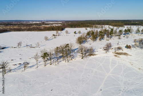 Aerial view of hill Friezenberg covered with snow and animal traces near Markelo, De Borkeld, Twente, Netherlands. photo