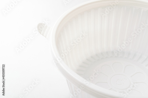 Plastic container on white background