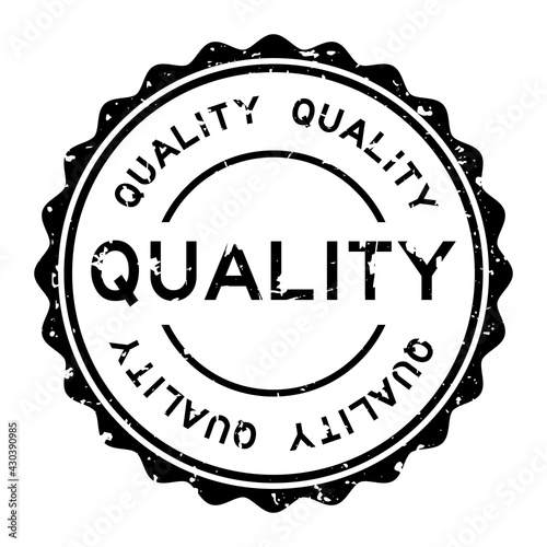 Grunge black quality word round rubber seal stamp on white background