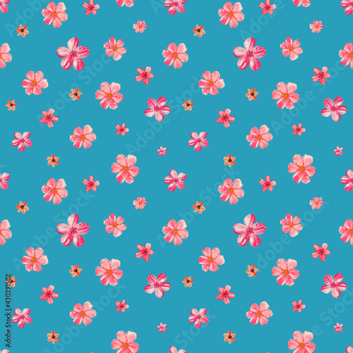 seamless watercolor floral pattern with pink flowers of different sizes on blue aquamarine background