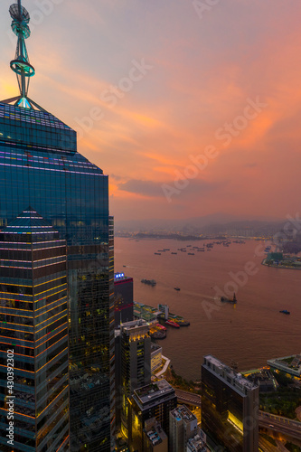 Hong Kong - 06 August 2020: Aerial view of Hong Kong downtown at sunset with skyscrapers in foreground and Kowloon bay in background, Central and Western District, Hong Kong. photo