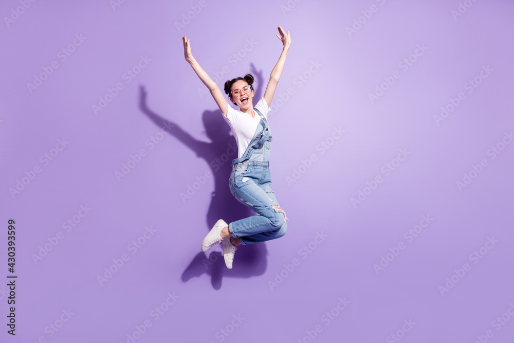 Full length profile photo of impressed brown hair lady jump wear spectacles t-shirt overall isolated on violet background