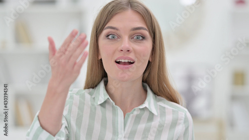 Portrait of Assertive Young Woman Inviting Gesture