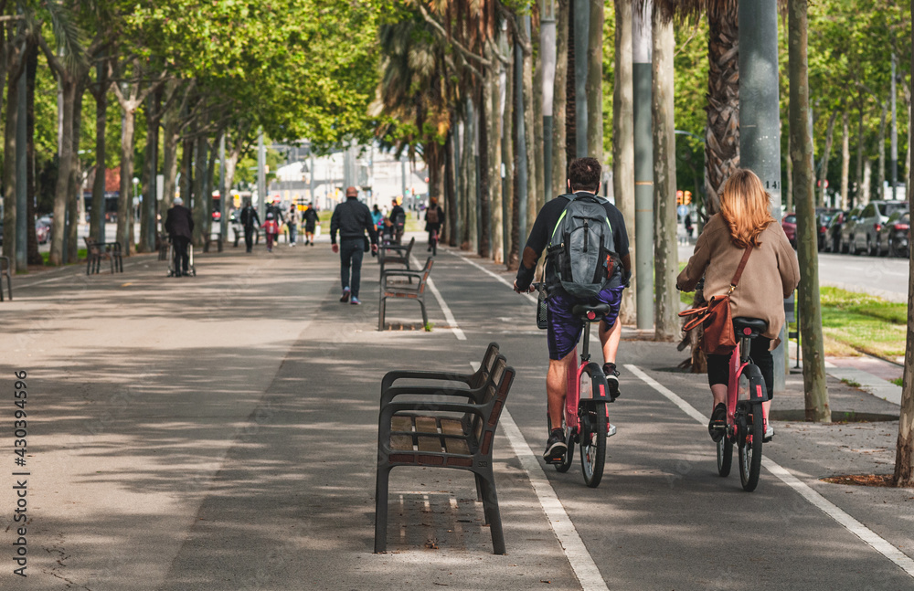 People on streets living and doing normal live in city, biking, sitting