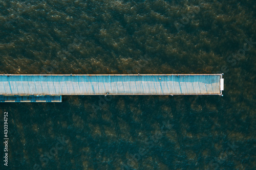 Aerial view of straight line shape pedestrian bridge in Baltic sea near Palanga, Lithuania. photo