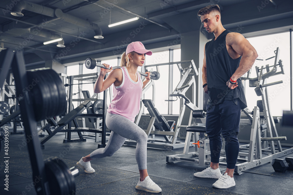 Fototapeta premium Side view of focused and motivated sporty young girl in sportswe