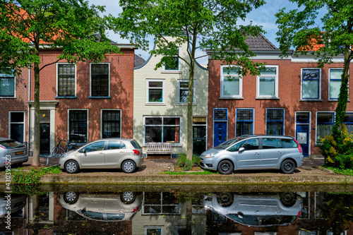 Cars on canal embankment in street of Delft. Delft  Netherlands