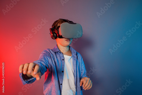 Teenager boy using a gaming gadget for virtual reality © oksix