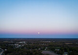 An aerial shot of the Pink Full Moon in 2021 rising from the horizon in Vineland, New Jersey. 