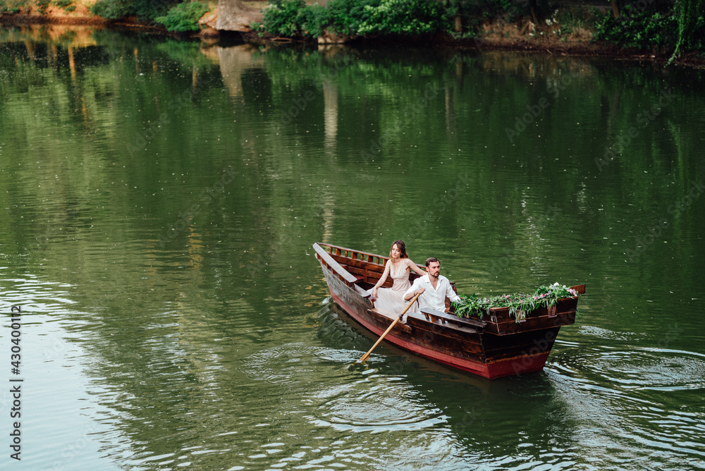 a boat trip for a guy and a girl along the canals and bays of the river a boat trip for a guy and a girl along the canals and bays of the river