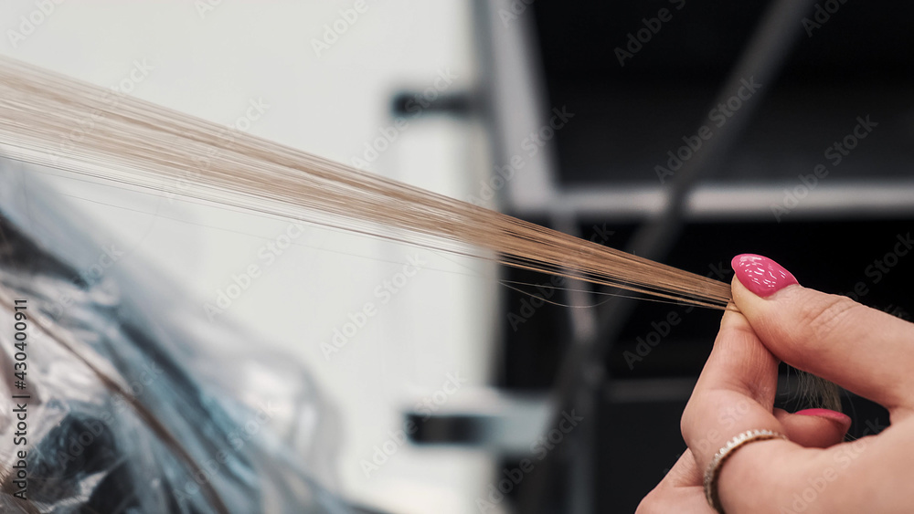 Hairstylist dyeing woman hair at beauty salon. Airtouch color technique. Closeup Hairstylist dyeing woman hair at beauty salon. Airtouch color technique. Closeup