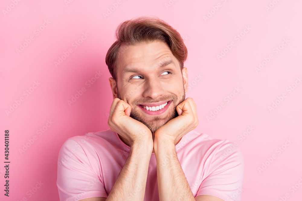 Photo of sweet cute young guy wear casual clothes arms cheeks chin looking empty space smiling isolated pink color background Photo of sweet cute young guy wear casual clothes arms cheeks chin looking empty space smiling isolated pink color background