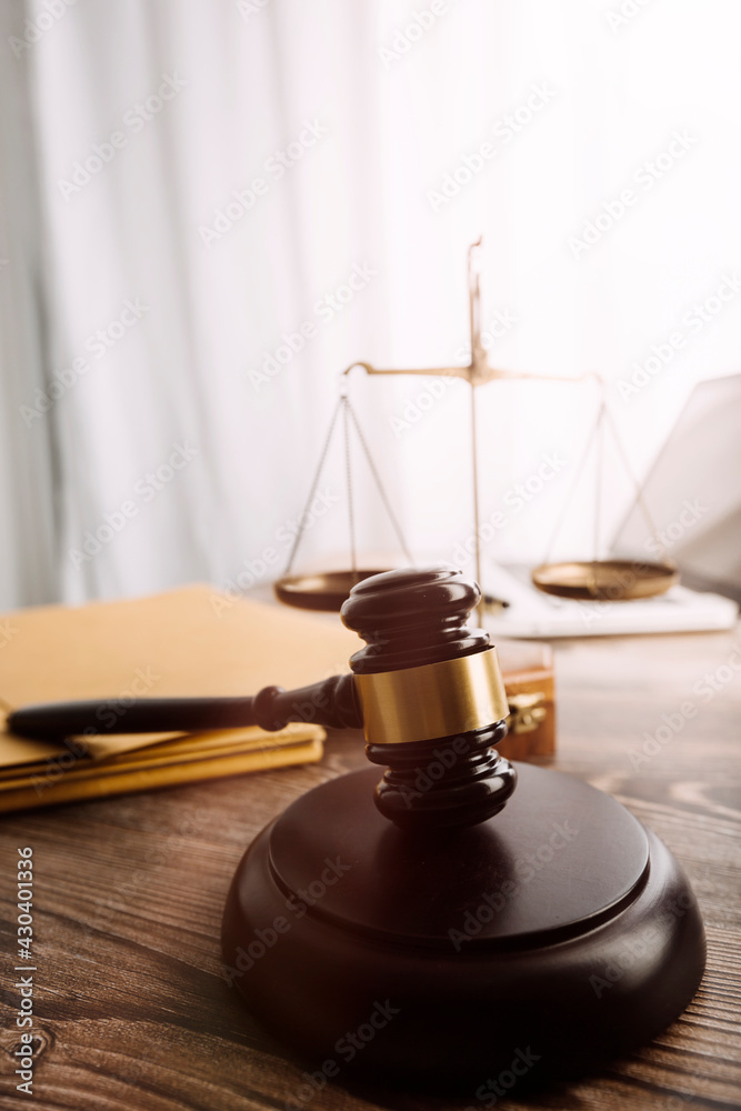 justice and law concept.Male judge in a courtroom on wooden table and Counselor or Male lawyer working in office. Legal law, advice and justice concept. justice and law concept.Male judge in a courtroom on wooden table and Counselor or Male lawyer working in office. Legal law, advice and justice concept.