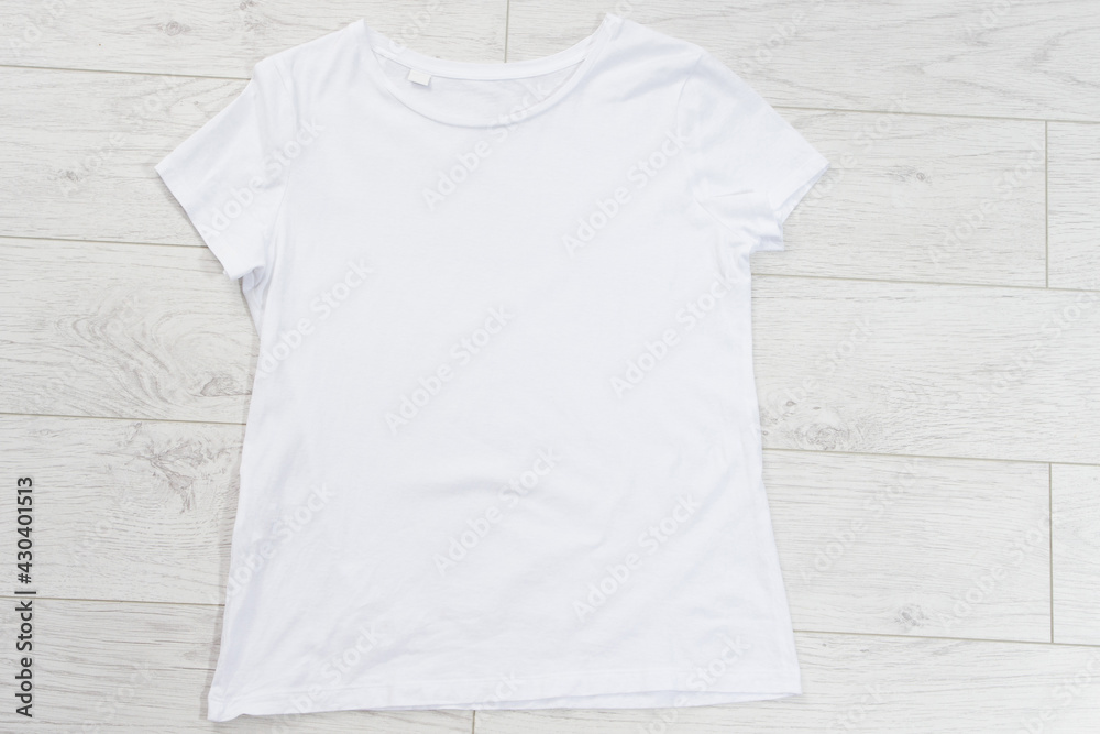White t-shirt mock up top view background empty shirt White t-shirt mock up top view background empty shirt
