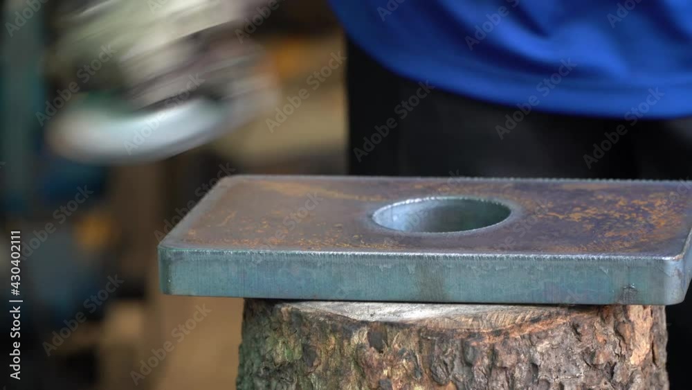 Worker with Angle Grinder does Metalworking in Industrial Environment. Worker with Angle Grinder does Metalworking in Industrial Environment.