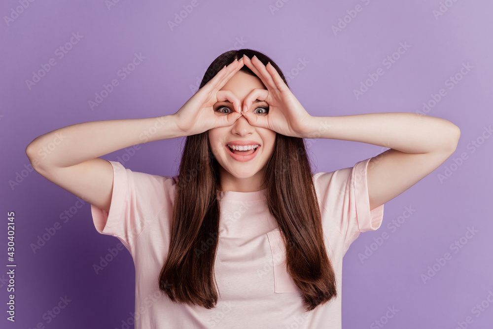 Portrait of funny young woman showing Ok sign cover eyes Portrait of funny young woman showing Ok sign cover eyes