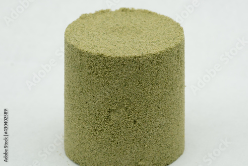 Kief, or dry sift hash, slightly compressed for form a cylinder shape 
