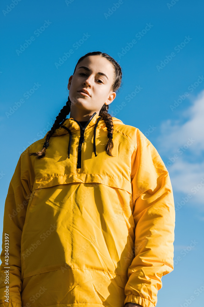 Portrait of teenage girl in yellow coat Portrait of teenage girl in yellow coat