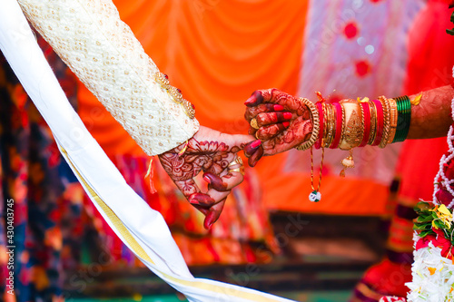 Beautiful Indian bride and groom hand with mehandi design photo