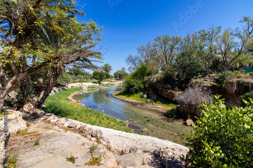 A small stream of clear water in a place that used to be a large pool, in Gan Hashlosha Park in the Beit She'an Valley