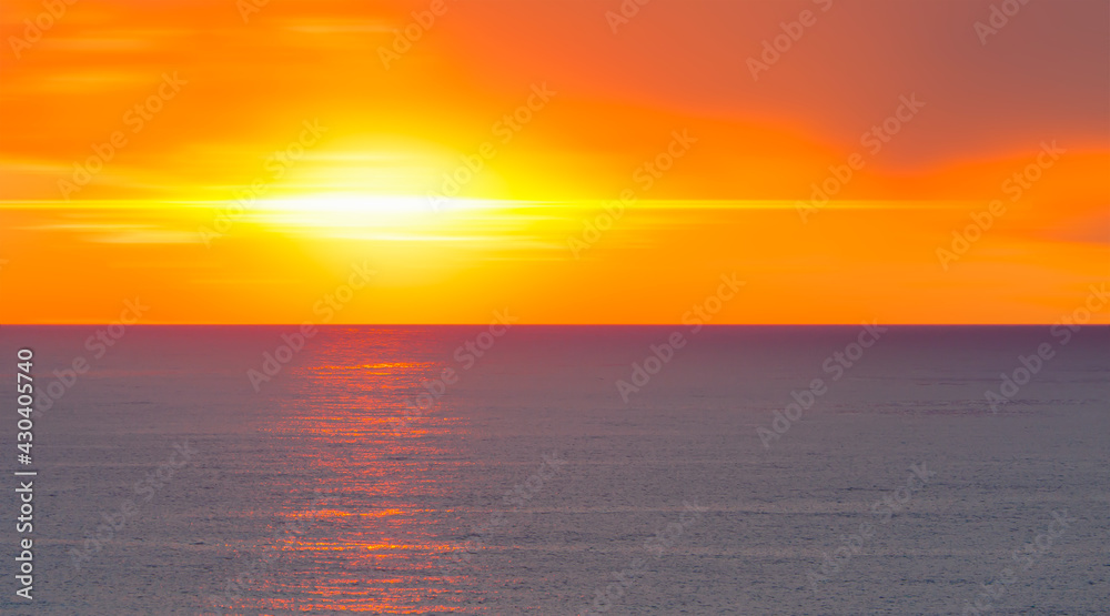 Amazing red sunset with yellow sun over the sea 