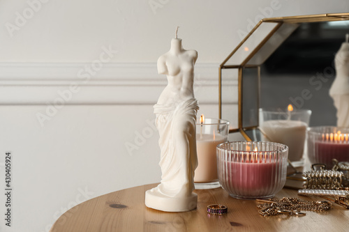 Beautiful Venus De Milo candle on wooden table. Stylish decor