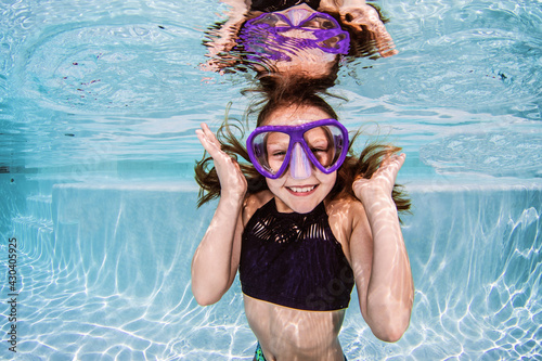 Girl diving in swimming pool