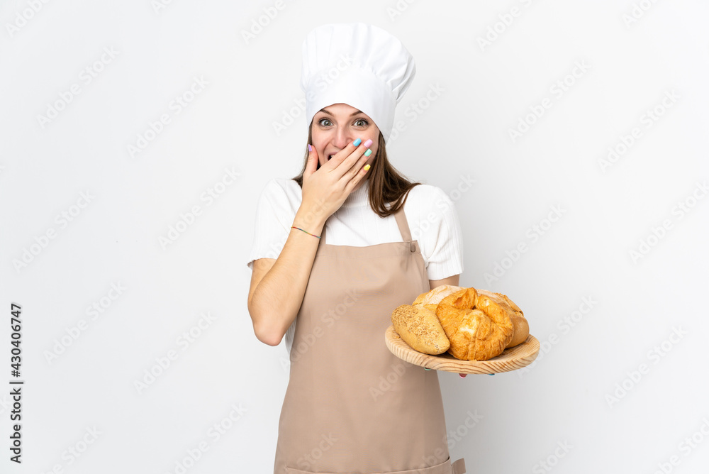 Young woman in chef uniform isolated on white background with surprise facial expression Young woman in chef uniform isolated on white background with surprise facial expression