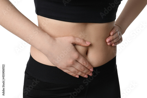 Woman suffering from pain in lower right abdomen on white background, closeup. Acute appendicitis © New Africa