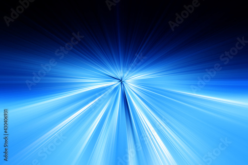 Abstract radial zoom blur surface of dark blue and light blue tones. Abstract bright blue background with radial, radiating, converging lines.