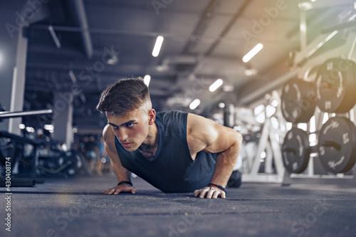 Young Adult Athlete Doing Push Ups As Part Of Bodybuilding Train