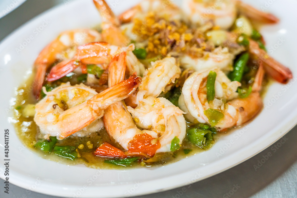 stir fried shrimp with thai chili and basil. stir fried shrimp with thai chili and basil.