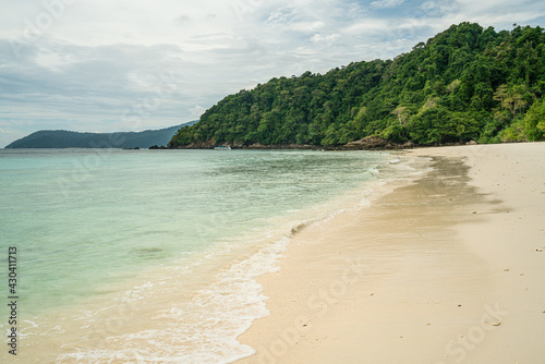 Wave crashing on beautiful beach in Ko Phayam island, Ranong, Thailand.